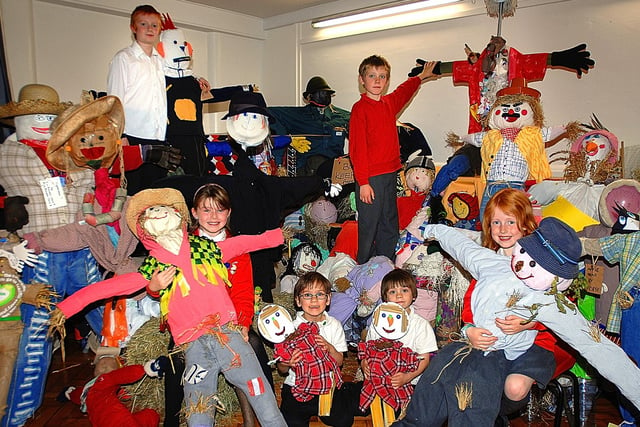 Pupils from Bilton Grange Primary School show off their handiwork after creating a Scarecrow made from recycled and found materials in 2009 - Lucy Barnes, Joe Atkinson, Finn West, Kate Cloggie and twins William and Harvey Kennedy