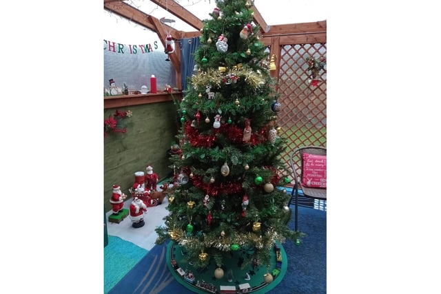 Mary Gilmore has put her fantastically festive tree on the 'sun porch' this year.