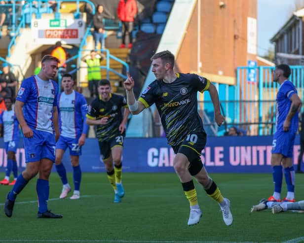 Matty Daly celebrates after firing Harrogate Town into a first-half lead against Carlisle United. Picture: Matt Kirkham