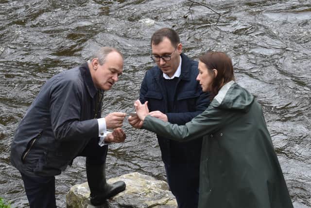 Harrogate Lib Dem Parliamentary candidate Tom Gordon and Sir Ed Davey discuss who how to do more to sort pollution in the river Nidd, including a new initiative to give it ‘Blue Flag’ status. (Picture contributed)