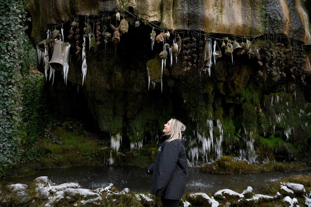 Denise Shard, Operations Manager at Mother Shipton's Cave, at the Petrifying Well that has frozen up due to the cold temperatures