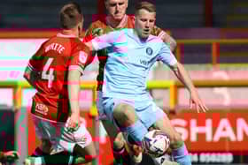 Bryn Morris in action during Harrogate Town's 2-1 victory at Morecambe on the final day of the 2024/25 season. Pictures: Matt Kirkham
