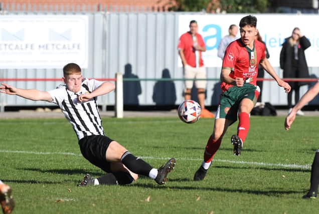 Harrogate Railway's Luca Bolino takes aim at the Athersley Recreation goal during Saturday's NCEL Division One clash. Pictures: Gerard Binks