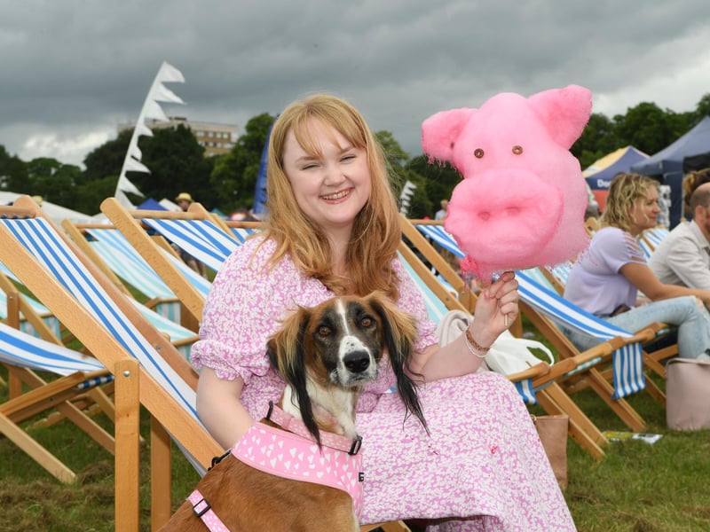 Hetty Shaw and her dog Mabel with a giant piggy candy floss at the festival