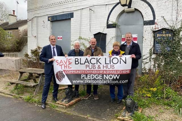 Local MP Julian Smith shows his support for the Black Lion's save the pub campaign