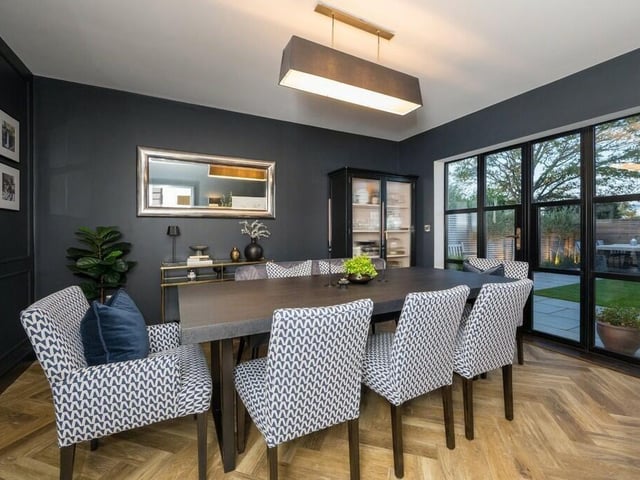 The dining room has doors leading out to the garden.