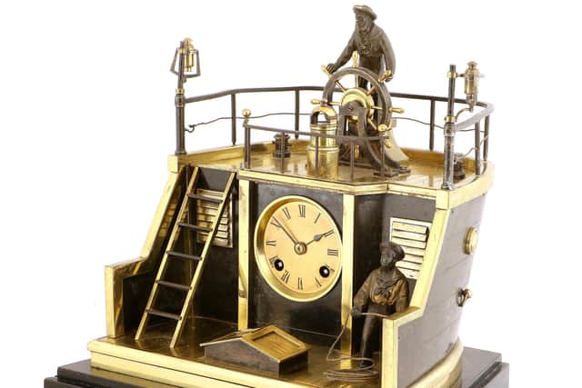 A French Automaton Clock, signed Guilmet, Paris, sold for £6,800.