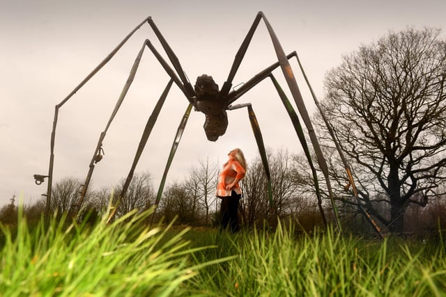 Sasha Jackson-Brown pictured with the sculpture called 'Large Spider' by Helen Denerley