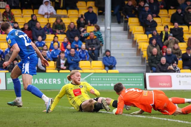 Harrogate Town striker Luke Armstrong is thwarted by Gillingham goalkeeper Glenn Morris during Saturday's League Two clash at Wetherby Road. Pictures: Matt Kirkham