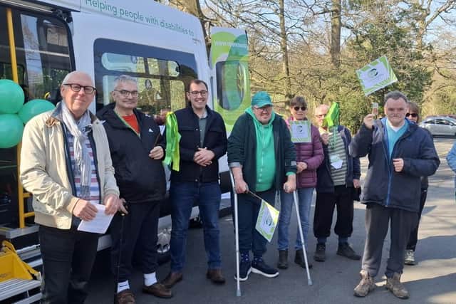 Harrogate and Knaresborough MP Tom Gordon joins trustees, volunteers and members of Open Country at the launch of the charity’s new electric minibus. (Picture contributed)