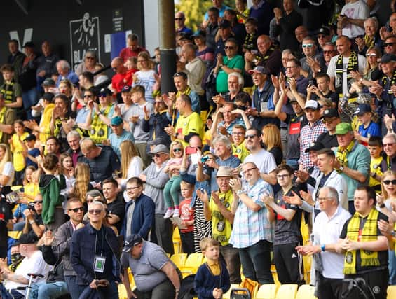 Harrogate Town supporters inside the EnviroVent Stadium. Pictures: Matt Kirkham