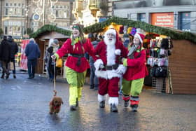 Harrogate Christmas Fayre success- Local entertainment and education firm Enchanticas with Father Christmas at the market. (Picture contributed)