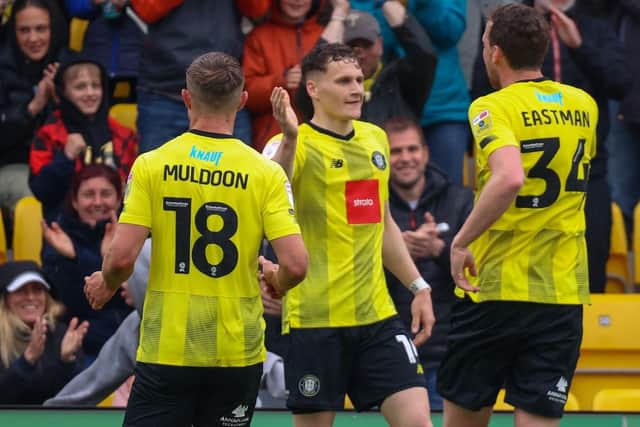 Toby Sims is congratulated after netting Harrogate Town's 74th-minute equaliser against Rochdale.