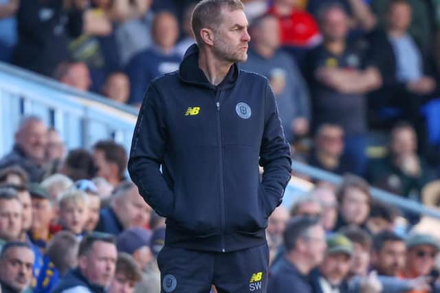 Sulphurites boss Simon Weaver takes in Saturday's narrow defeat on the road at AFC Wimbledon.