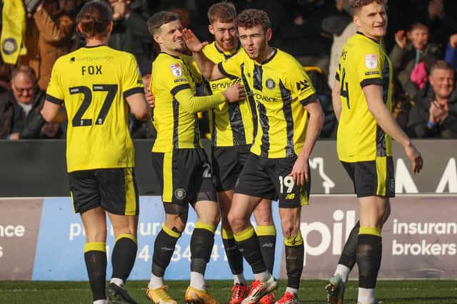 Tom Hill, second from right, celebrates with his Harrogate Town team-mates after the Sulphurites took a 19th-minute lead against Accrington Stanley.
