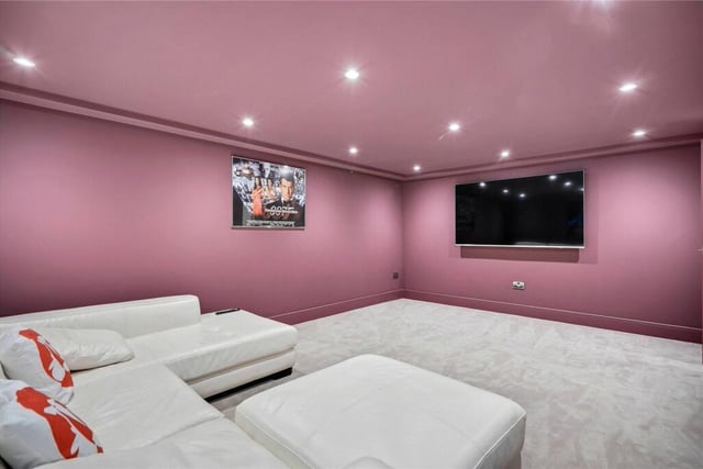 The cinema room is on the lower ground floor of the property.