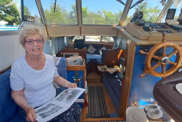 Sylvia Coe on her boat, enjoying the best of the summer weather