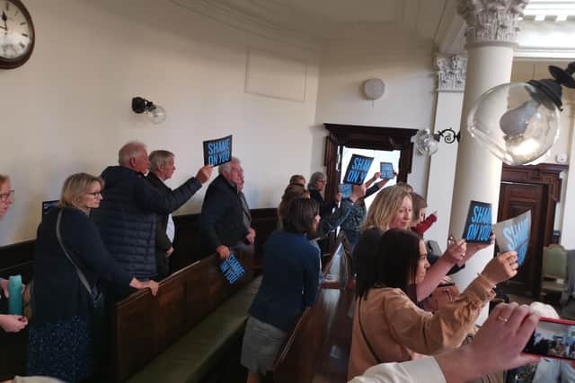Campaigners held up banners with the words 'shame on you' after the vote. PHOTO: LDRS.