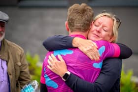 Harrogate man Simon Gregory hugs his late Aunty Ruth's nurse, Mairead, after cycling 288 miles in a sub-24-hour time for Macmillan Cancer Support.