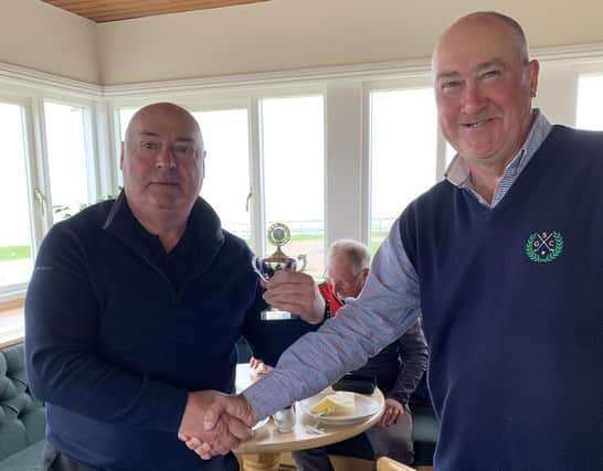 Masham Golf Club's TAGGS 2022 winner, Paddy Lafford, left, is presented with his trophy by former champion Paul Mullen. Picture: Submitted