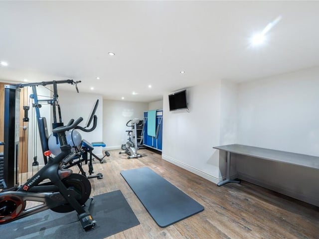 Versatile garage space is currently used as a home gym.