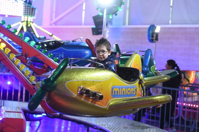 Pictured 4-year-old Oliver Jackson enjoys on of the rides.