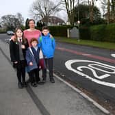 Schools 20mph campaign supporter Dr Jenny Marks with, from left Elsa Lily aged 12, Emma Marks aged 6 and Sam Marks aged 11 on Pannal Ash Road. (Picture Gerard Binks)
