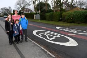 Schools 20mph campaign supporter Dr Jenny Marks with, from left Elsa Lily aged 12, Emma Marks aged 6 and Sam Marks aged 11 on Pannal Ash Road. (Picture Gerard Binks)