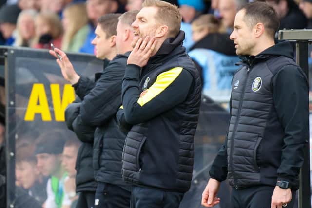 Harrogate Town manager Simon Weaver looks on from his technical area during Saturday's League Two clash with Barrow.