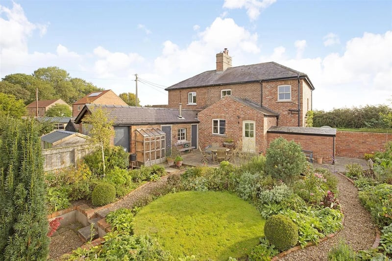 The cottage has an attractive lawned garden with deep planted borders.