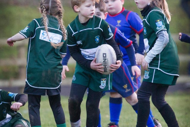Lachlan Graham with the ball for Hawick Minis against Jed Jaguars