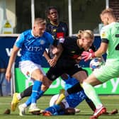 Harrogate Town striker Luke Armstrong sees a header saved by Stockport County goalkeeper Vitezslav Jaros during Saturday's League Two stalemate at Edgeley Park. Pictures: Matt Kirkham