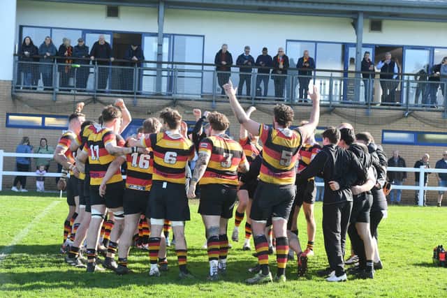 Harrogate RUFC's 1st XV squad celebrate beating Driffield and gaining promotion.