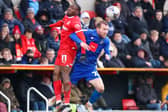 Stephen Dooley challenges for a header during Harrogate Town's 1-1 League Two draw at Swindon Town. Pictures: Matt Kirkham