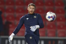 Mark Oxley warms up ahead of Harrogate Town's League Two clash at Salford City. Pictures: Paul Thompson/ProSportsImages