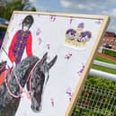 Harrogate artist James Owen Thomas at Pontefract Racecourse with his new artwork for the Coronation commissioned by Great British Racing. (Picture Great British Racing)