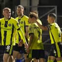 Dean Cornelius celebrates with his Harrogate Town team-mates after netting the only goal of the game during Friday night's FA Cup win over Gainsborough Trinity. Pictures: Matt Kirkham