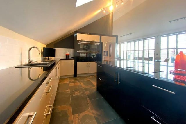 The high spec, open plan kitchen has integrated appliances.
