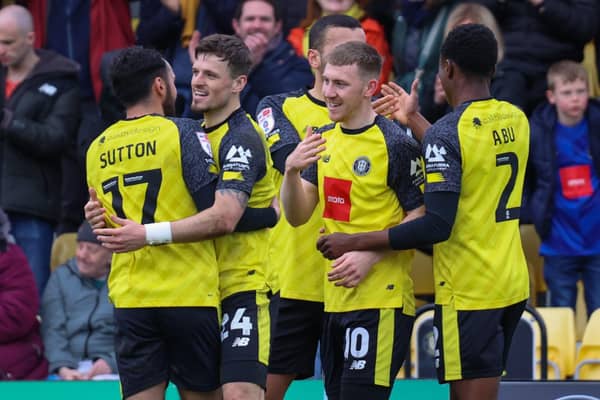 Harrogate Town players celebrate the Matty Daly goal which saw them come from behind to take the lead as they thrashed fellow play-off hopefuls Gillingham 5-1 at Wetherby Road on Easter Monday. Picture: Matt Kirkham