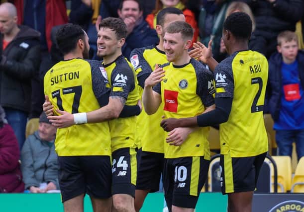 Harrogate Town players celebrate the Matty Daly goal which saw them come from behind to take the lead as they thrashed fellow play-off hopefuls Gillingham 5-1 at Wetherby Road on Easter Monday. Picture: Matt Kirkham