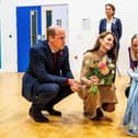 The Prince and Princess of Wales attend The Street In Scarborough here they meet 2 year old Callie and are presented with Flowers and Gifts.