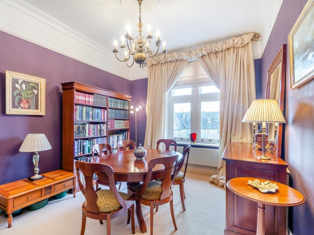 The formal dining room has flexible space.