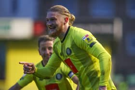 Luke Armstrong celebrates after putting Harrogate Town 3-0 up against Mansfield Town at Wetherby Road. Pictures: Matt Kirkham