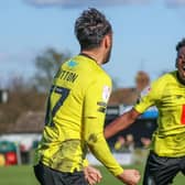 Harrogate Town midfielder Levi Sutton, left, celebrates his stoppage-time equaliser against AFC Wimbledon with team-mate Kazeem Olaigbe. Picture: Matt Kirkham