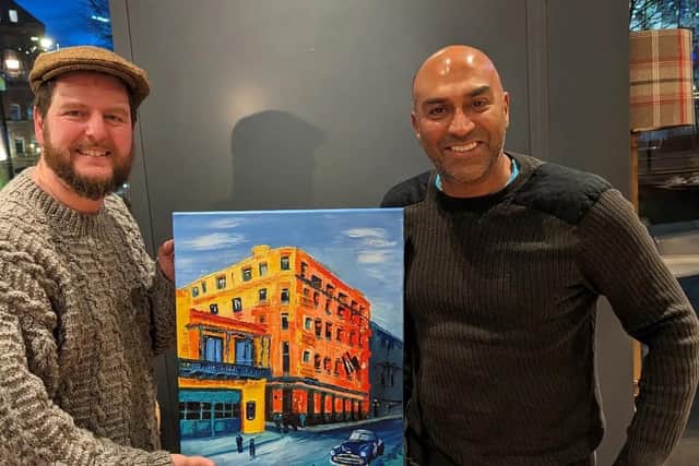 The Singing Conductor Paul Mirfin with blind TV celebrity and business man Amar Latif and the painting he was commissioned to do for him.