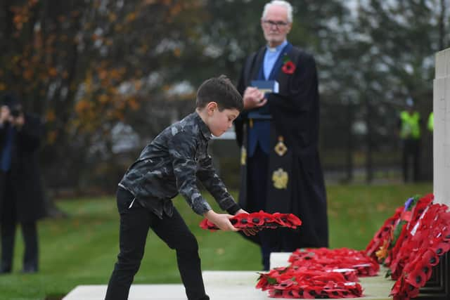 Seven-year-old Henry Dunn from Knaresborough lays a wreath at the Remembrance service at the Commonwealth War Graves Cemetery in Harrogate last year