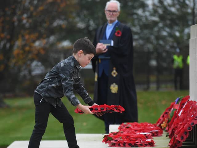 Seven-year-old Henry Dunn from Knaresborough lays a wreath at the Remembrance service at the Commonwealth War Graves Cemetery in Harrogate last year