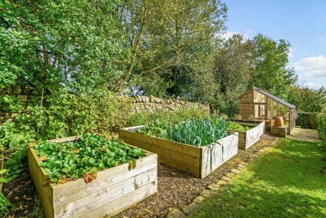 Along with its landscaped gardens, the cottage has a wildflower meadow and paddock land, raised beds and a greenhouse.