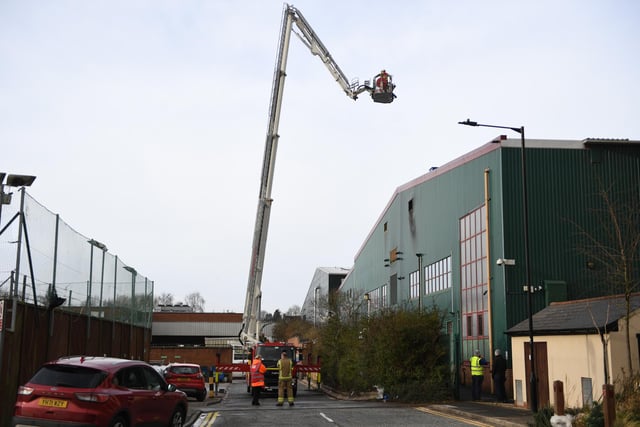 Photographer Gerard Binks' dramatic shot of Harrogate firefighters climbing to the top of a crane to tackle today's blaze Bettys & Taylors factory in Harrogate. (Picture Gerard Binks)