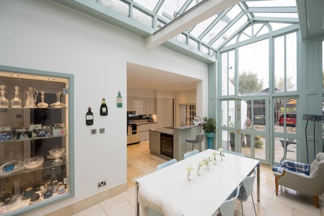 The kitchen with diner is light and airy, with a feature glazed roof.
